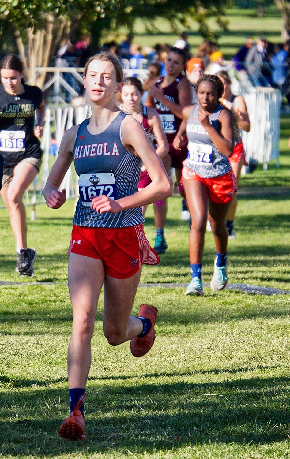 Olivia Hughes ran fastest for Mineola, followed closely here by Shylah Kratzmeyer and Hannah Zoch. [View more of the competition.]